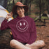 Introducing the latest in outdoor fashion and forest friendliness: the "Tree-mendous Smiles Hoodie"! This isn't just any hoodie; it's your ticket to becoming the most smiley face in the wild. With a dazzling happy face emblazoned on the front, you're set to spread joy among the trees, the birds, and even the most stubborn of rocks.